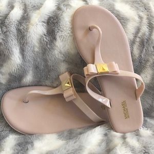 MK pink sandals with gold logo bow accent. Size 10